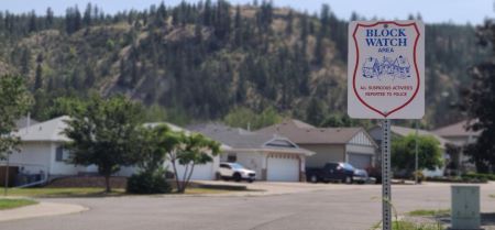 A ‘Block Watch Area’ sign is posted along the street in a Kamloops neighbourhood. 