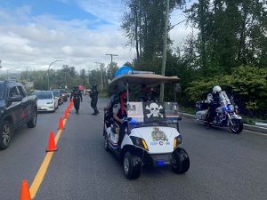 Photo of officers dressed as pirates on a golf cart.