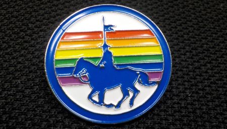 Pride Flag Pin -- A round pin with a blue silhouette of a horse and rider with a rainbow in the background.  