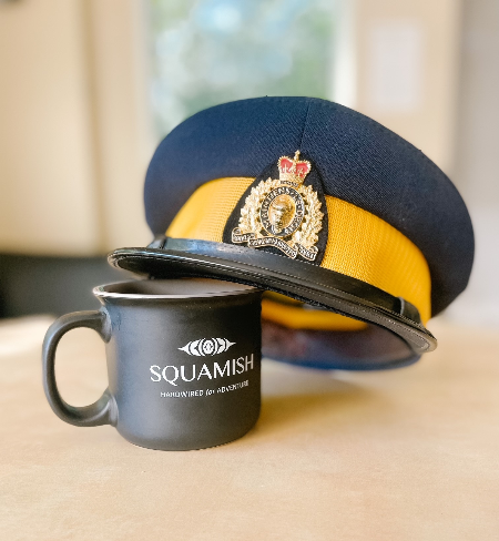 Coffee mug with Squamish logo and a forage cap