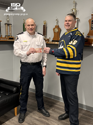In keeping with tradition, Prince George Fire Chief Warner donned the winning jersey and made a donation of his own toward the RCMP’s chosen charity.